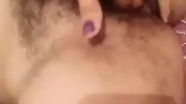 Indian girl nude MMS of a girl fingering her hairy pussy