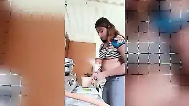 Chubby Desi gal while cooking can barely hide her perky XXX boobs