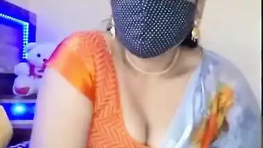 Desi takes sari down a bit to expose her naked XXX assets at home