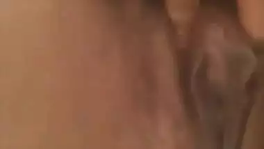 Rubbing her pussy