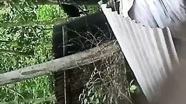 Village neighbor girl outdoor bath caught through hole