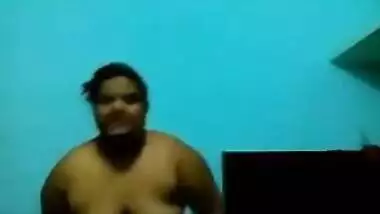 Mature Desi in a red sari exposes her big sex parts in a XXX show