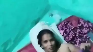 Village sex of a wife putting a condom on dick before sex
